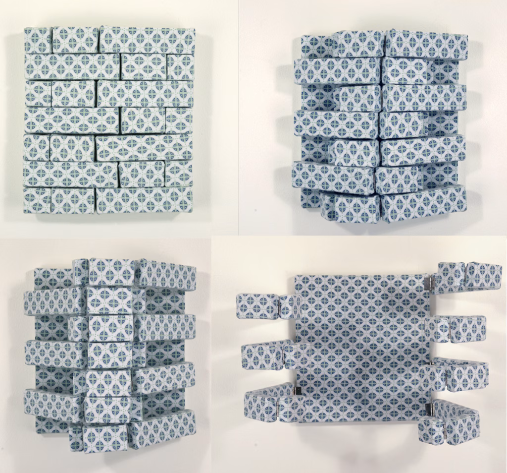 A 2x2 grid of photos of a 'transformer' artwork. It is a wooden sculpture affixed to the wall. The back is a solid block of wood, and attached to that are wooden block appendages on hinges that can be moved around and reshaped. All of the wood is covered with hospital gown material. The pattern is a light green with a dark green dot pattern. From L to R, top to bottom, the transformer is completely closed in a flat rectangular shape. In the 2 and 3rd images, its appendages are curled in like a rib cage. In the 4th final image, all the appendages are stretched out from the wooden base.